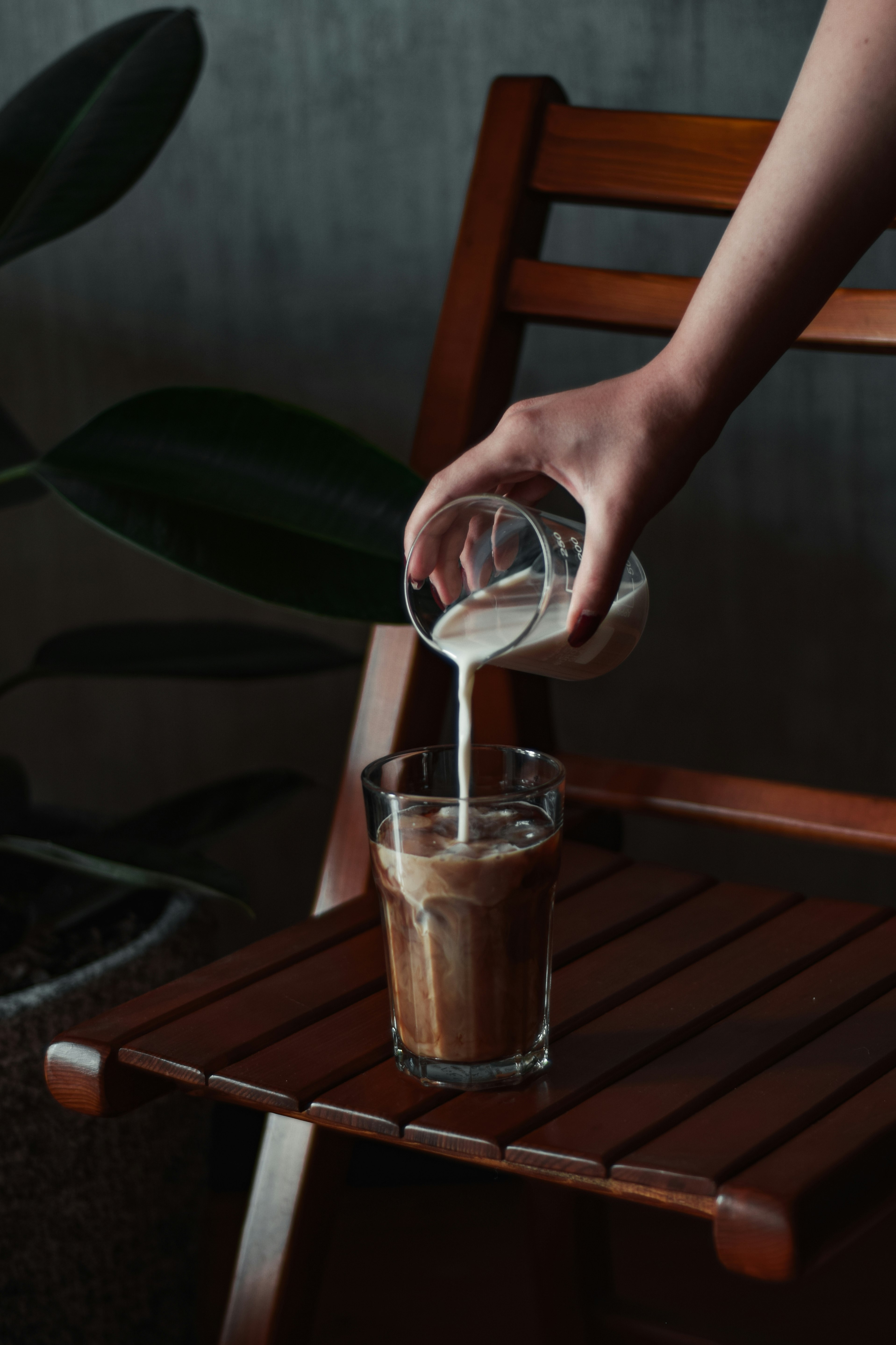 person holding clear drinking glass with water